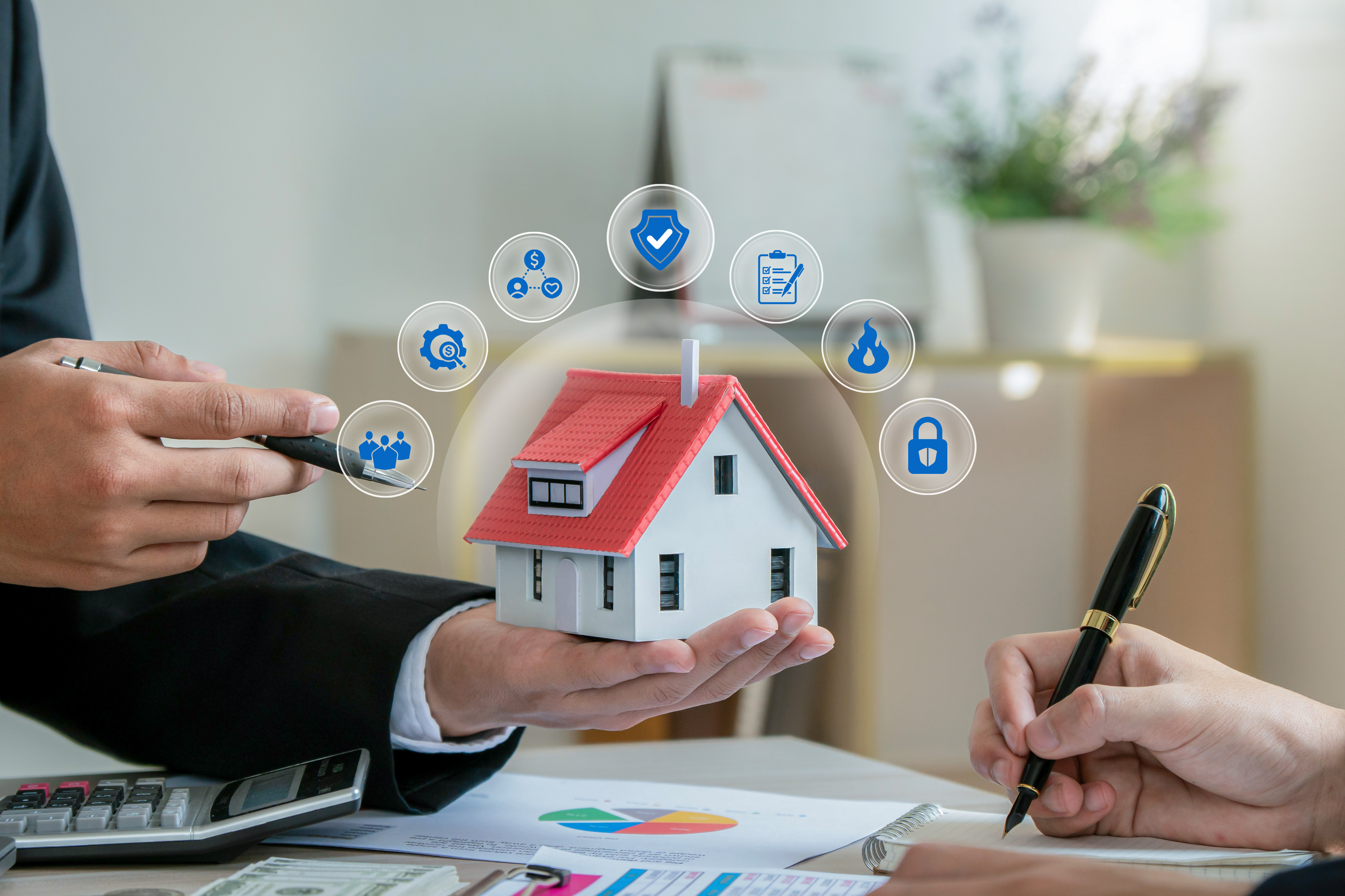 a%20person%20holding%20a%20house%20figurine%20with%20icons%20indicating%20insurance%20coverage